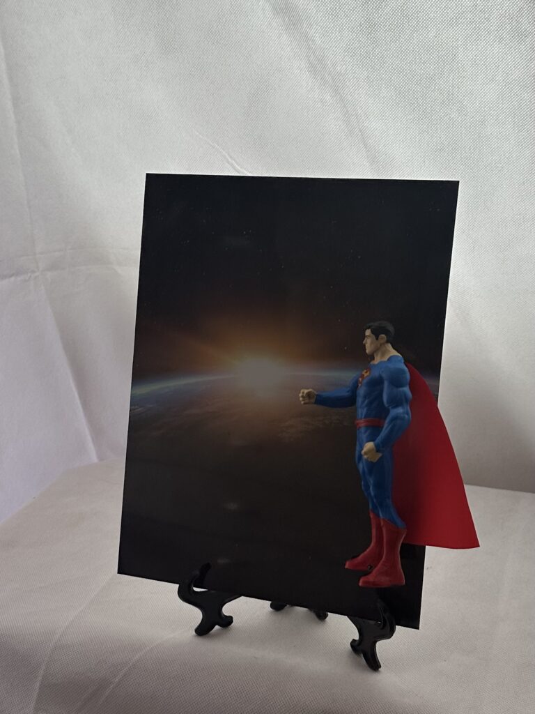 Superhero edition collectable figure and display (Man from another world), custom background. Includes stand and wall attachment